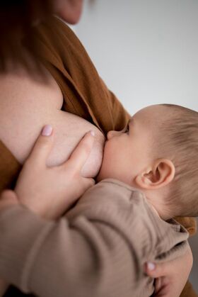 Close-up photo of a woman breastfeeding